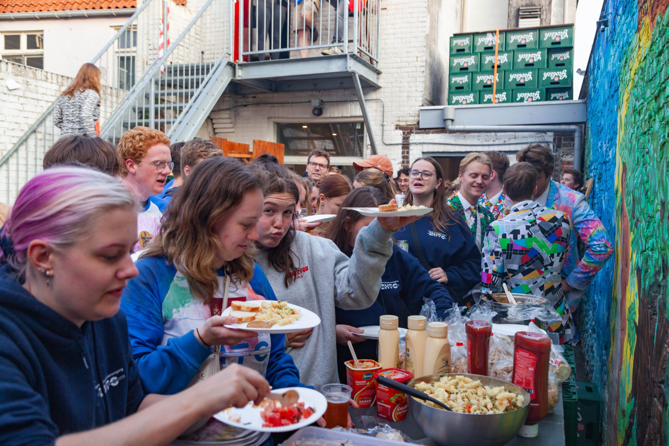Our members serve food in our garden during the afentiká barbecue